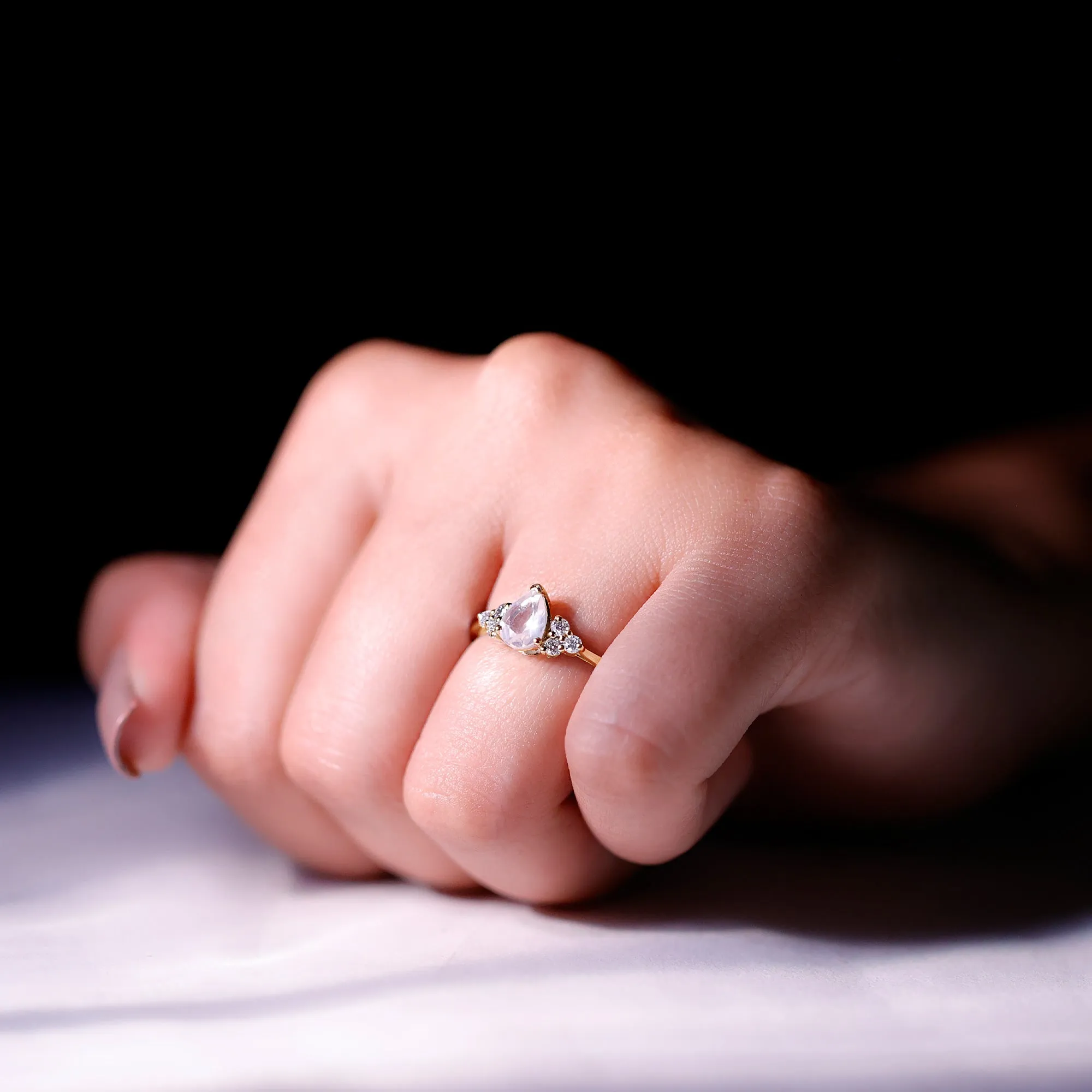 Pear Shaped Rose Quartz Solitaire Engagement Ring with Diamond Trio