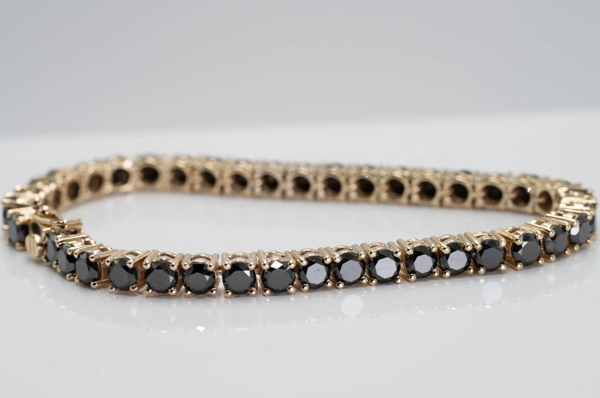 "Valentine's Sparkle: 10K Gold Black Diamond Tennis Bracelet"